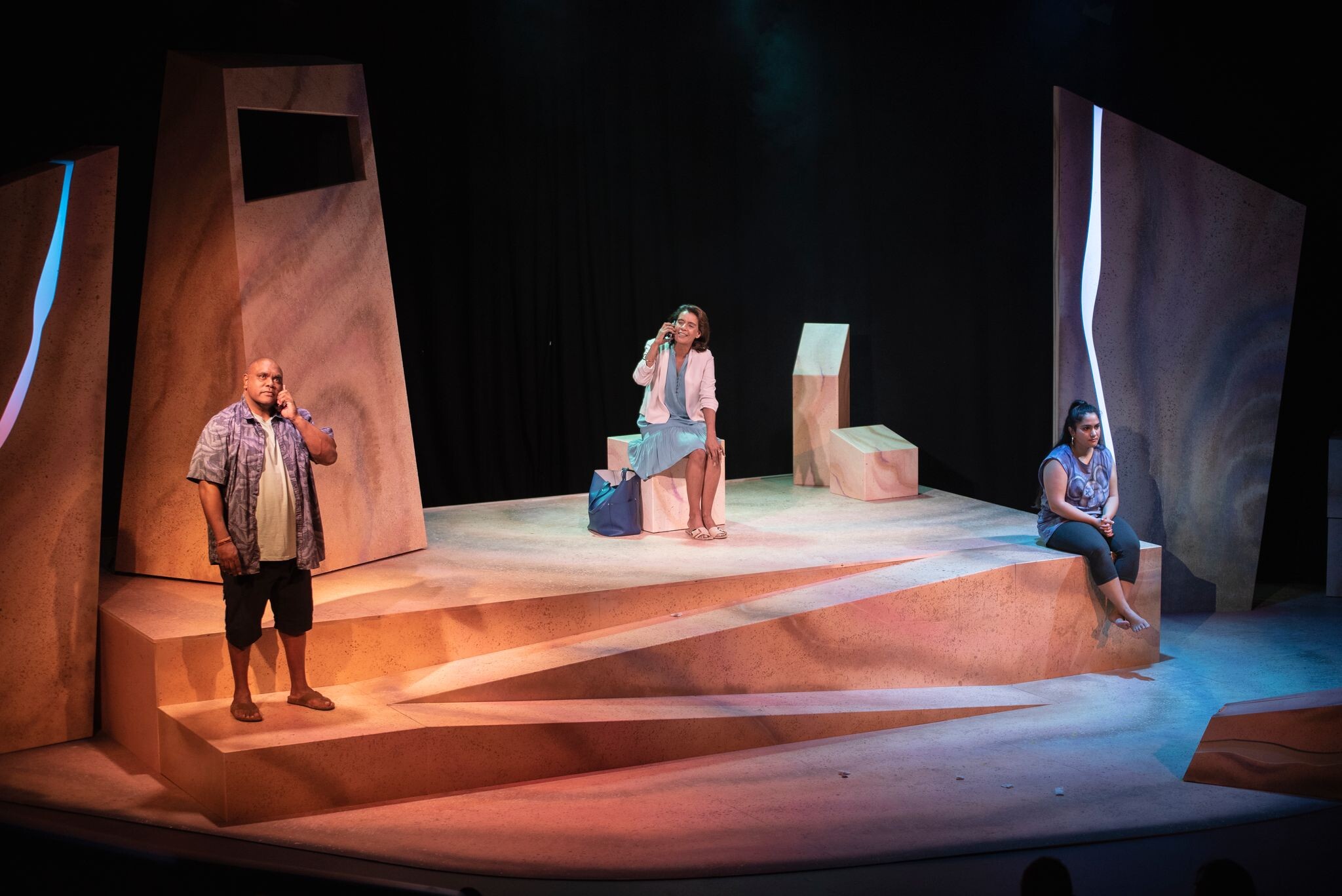 The whole cast standing on stage in various positions during show