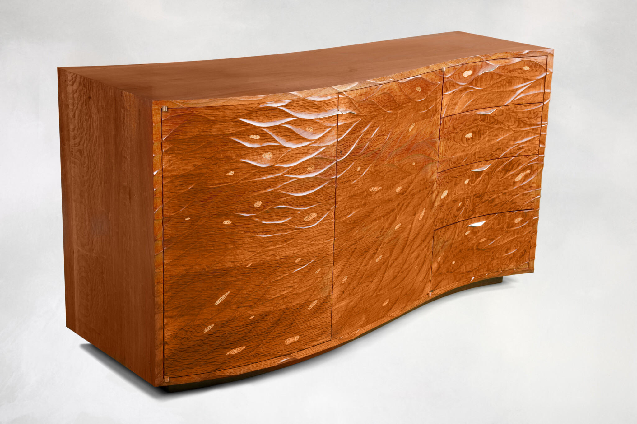 Curvy wooden cupboard with two doors on the left and four drawers on the right.