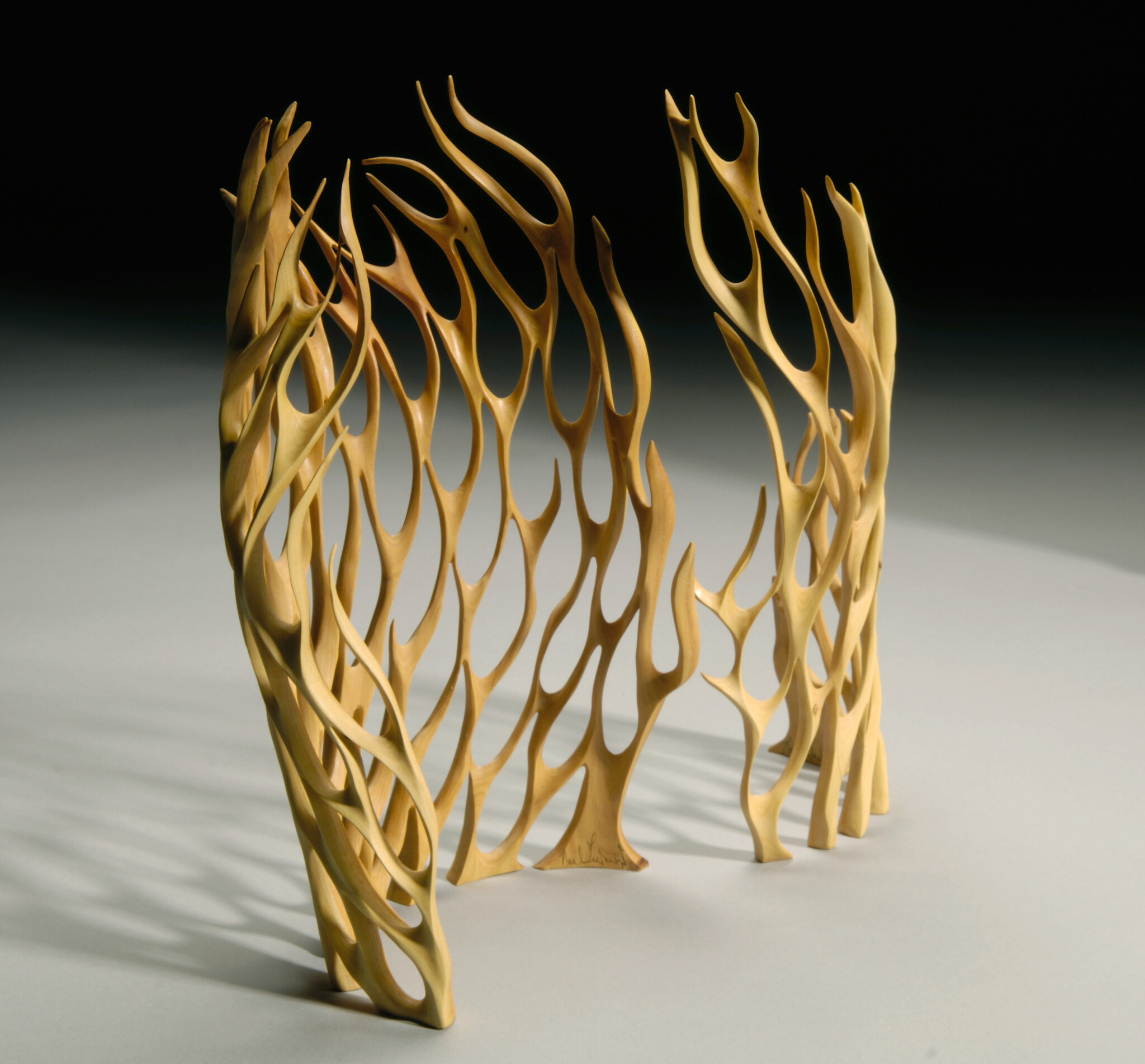 Wooden sculpture of two flames.