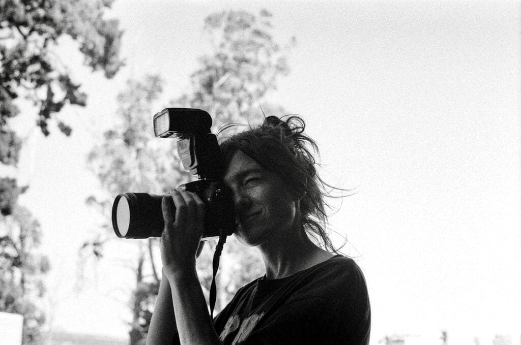 Image: Leith Alexander behind the lens. Photo by Margaret-Ellen Burns.