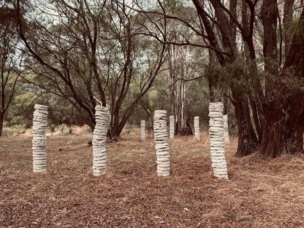 8 clay columns standing in the bush