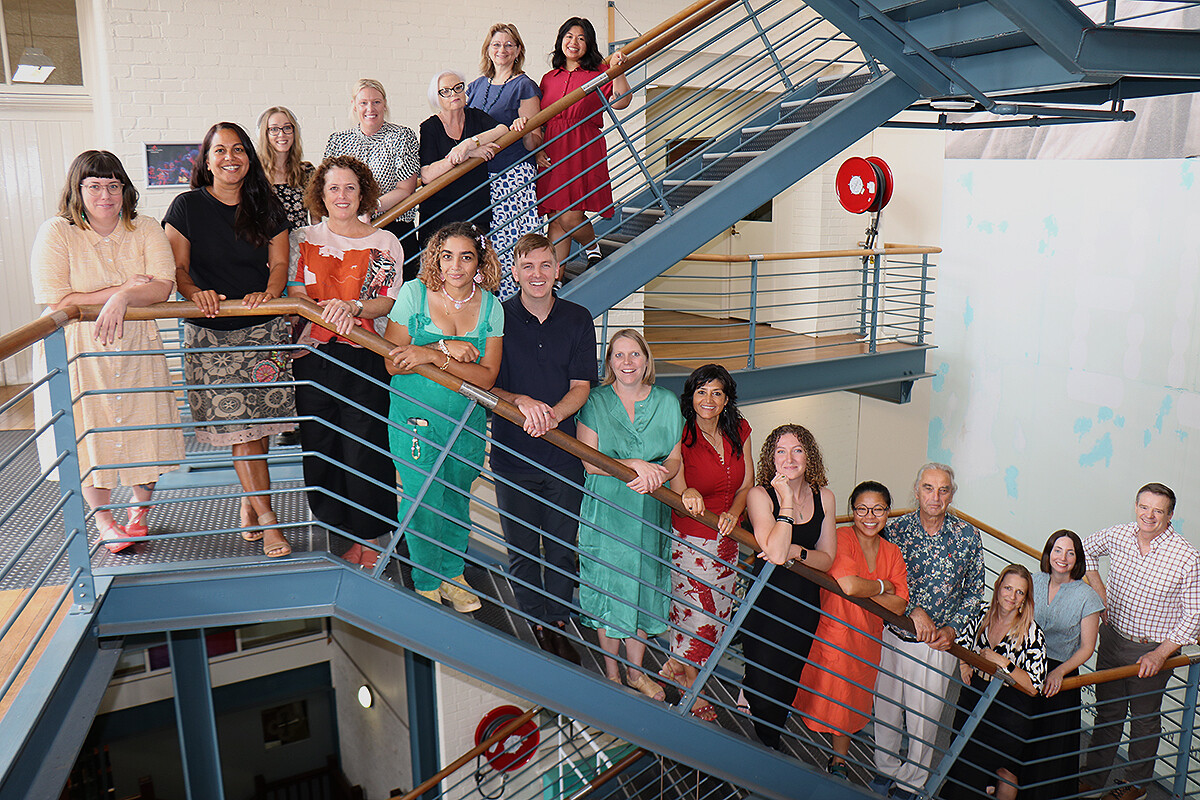 Regional Arts WA Staff and Board members on the staircase at King Street Arts Centre.