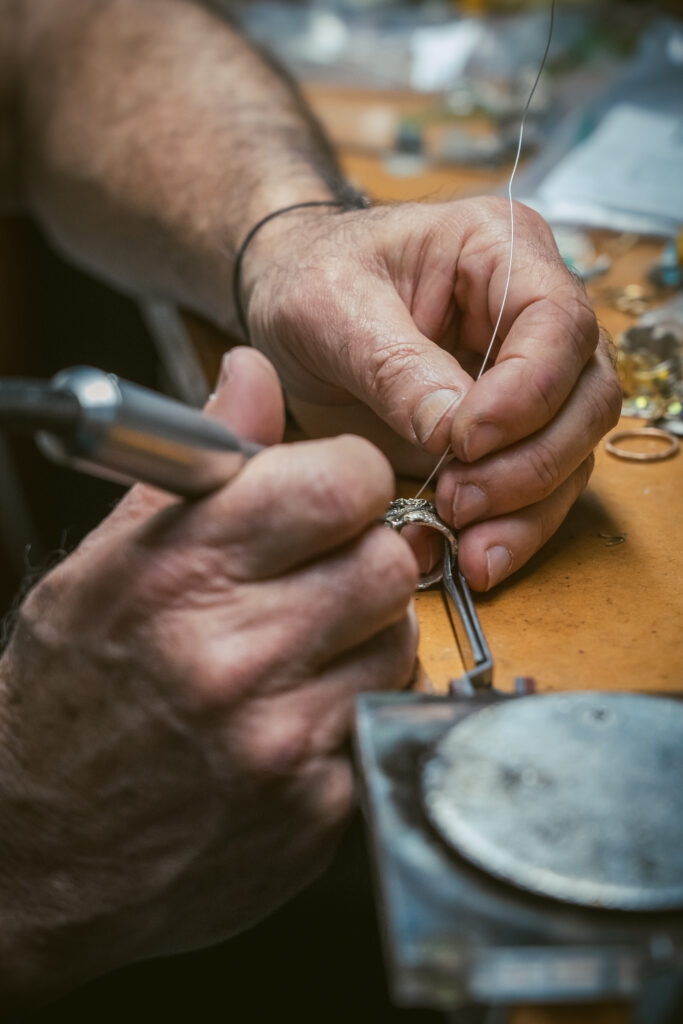 hands working on jewellery