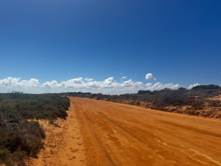Unsealed red dirt road in Carnarvon