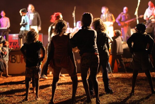 The Warburton community dancing to support act, Running Water, at the 2014 Sand Tracks tour. The 2016 tour, headlined by the legendary Lajamanu Teenage Band and supported by Desert Hip Hop, will once again visit the town of Warburton, and 5 other communities in the central desert region.